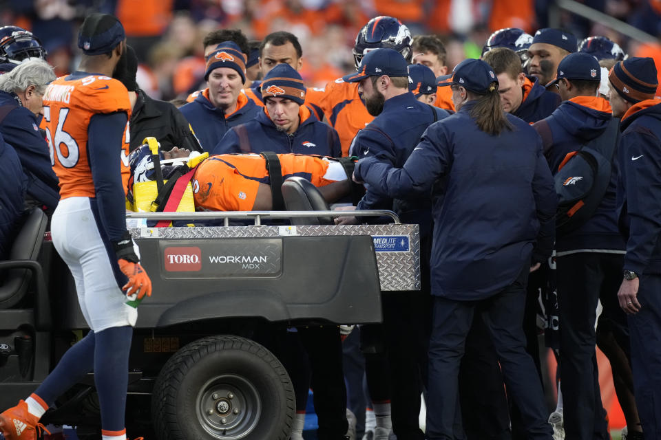 Denver Broncos quarterback Teddy Bridgewater is placed on a cart after being injured against the Cincinnati Bengals during the second half of an NFL football game, Sunday, Dec. 19, 2021, in Denver. (AP Photo/David Zalubowski)