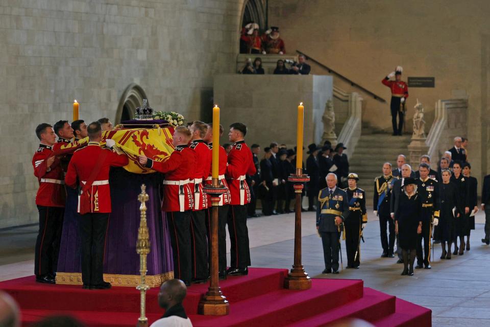 The royal family stands in front of the Queen's coffin at Westminster Hall.