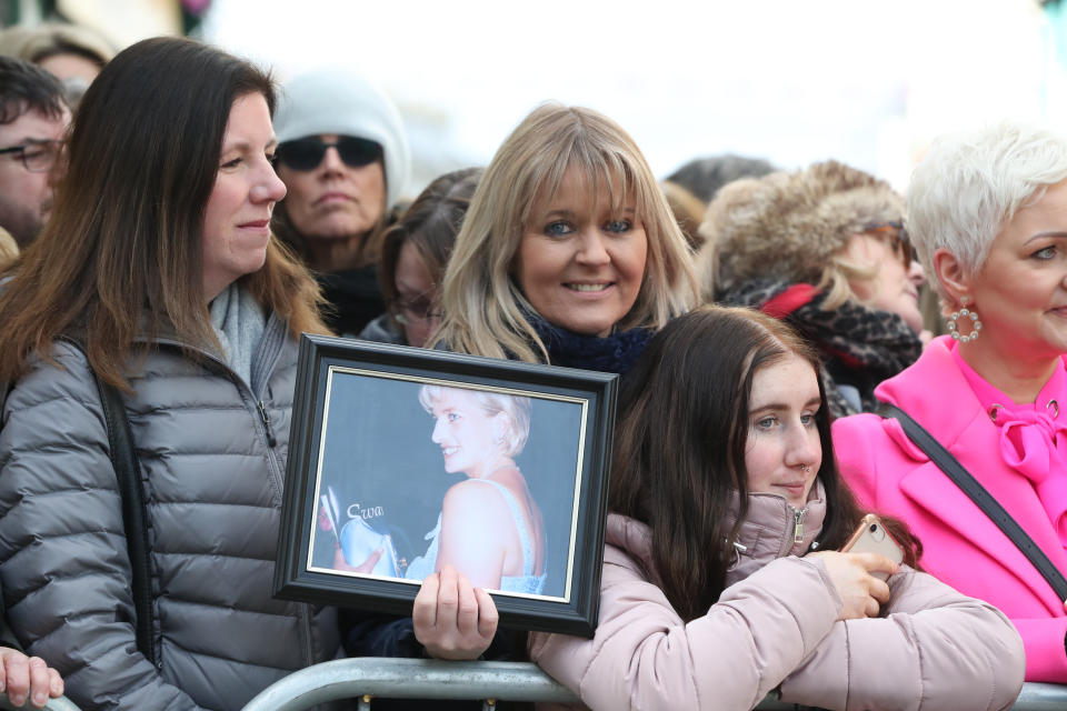 Michelle Rogers, from Co Laois, holding a picture of the Princess of Wales as she awaits the arrival of the Duke and Duchess of Cambridge for a visit to a traditional Irish pub in Galway city centre during the third day of their visit to the Republic of Ireland. (Photo by Niall Carson/PA Images via Getty Images)