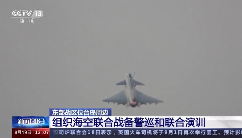 A Chinese fighter jet takes off from China for drills on Saturday (AP)