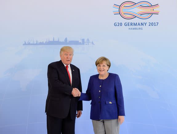 HAMBURG, GERMANY - JULY 06: German Chancellor Angela Merkel receives U.S. President Donald Trump in the Hotel Atlantic, on the eve of the G20 summit, for bilateral talks on July 6, 2017 in Hamburg, Germany. Leaders of the G20 group of nations are meeting for the July 7-8 summit. Topics high on the agenda for the summit include climate policy and development programs for African economies.  (Photo by Jens Schluter - Pool/Getty Images)