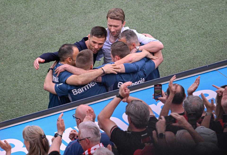 Xabi Alonso celebrates with his staff at full-time (AFP via Getty Images)