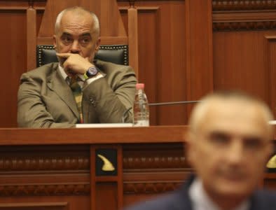 Albania's Prime Minister Edi Rama (L) listens to Ilir Meta, newly elected President of Albania holding speeach in the parliament in Tirana, Albania, April 28, 2017. REUTERS/Florion Goga