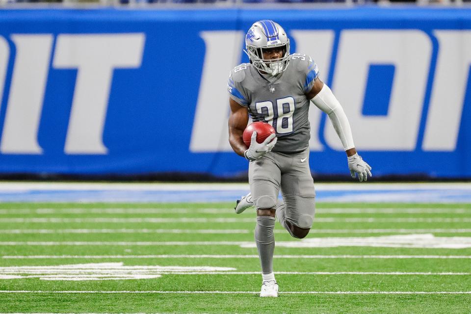 Detroit Lions safety C.J. Moore (38) runs against Miami Dolphins in a fourth down trick play during the first half at Ford Field in Detroit on Sunday, Oct. 30, 2022.