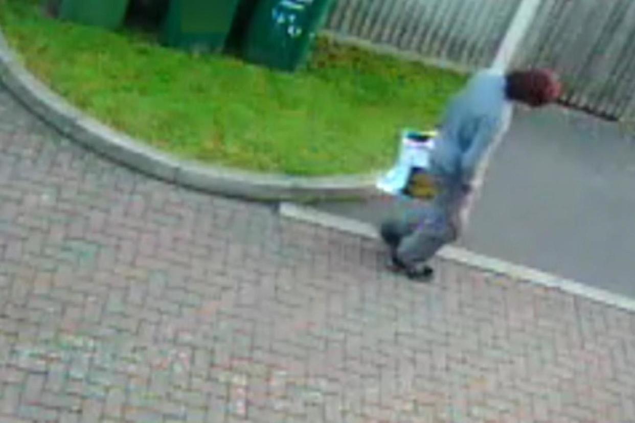 CCTV: The footage was taken outside the home in Surrey that has been raided by police: ITV News