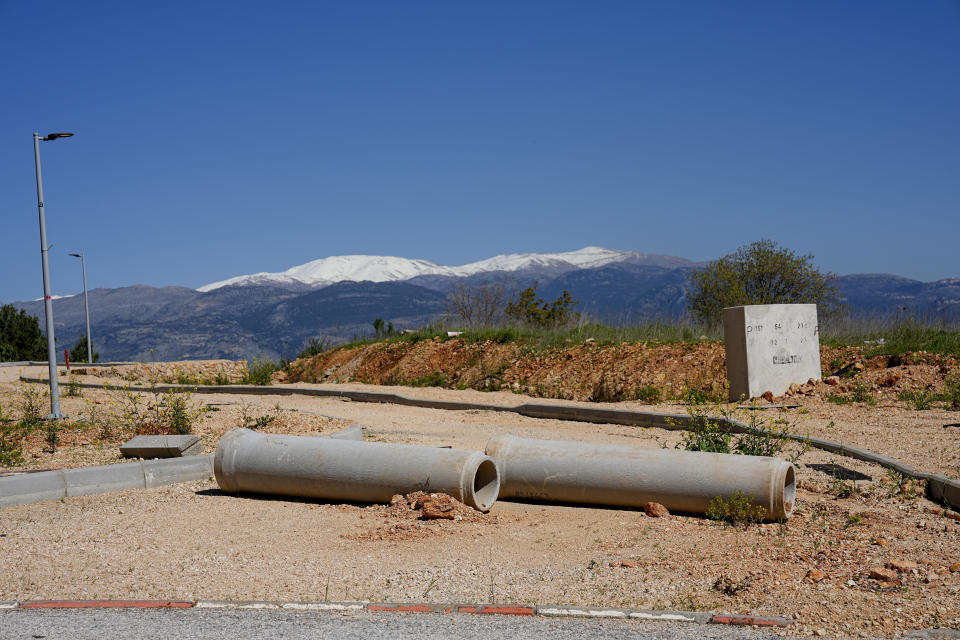 The work on a road under constructions is halted in Kiryat Shmona, northern Israel, on the border with Lebanon Thursday, Feb. 29, 2024. Around 60,000 Israelis who evacuated from cities and towns along the border with Lebanon are grappling with the question of when they will be able to return home. Hezbollah began launching rockets towards Israel one day after Hamas-led militants stormed into southern Israel on Oct. 7. (AP Photo/Ariel Schalit)