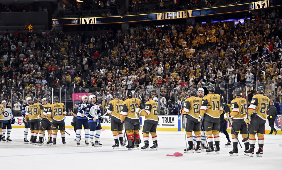 Vegas Golden Knights and Winnipeg Jets shake hands after the Golden Knights defeated the Jets 4-1 in Game 5 of an NHL hockey Stanley Cup first-round playoff series Thursday, April 27, 2023, in Las Vegas. The Golden Knights won the series. (AP Photo/David Becker)