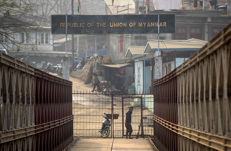 A Myanmarese man looks towards the Indian side at the India-Myanmar border in Mizoram, India, Saturday, March 20, 2021. Several Myanmar police officers who fled to India after defying army orders to shoot opponents of last month’s coup are urging Prime Minister Narendra Modi’s government to not repatriate them and provide them political asylum on humanitarian grounds. (AP Photo/Anupam Nath)