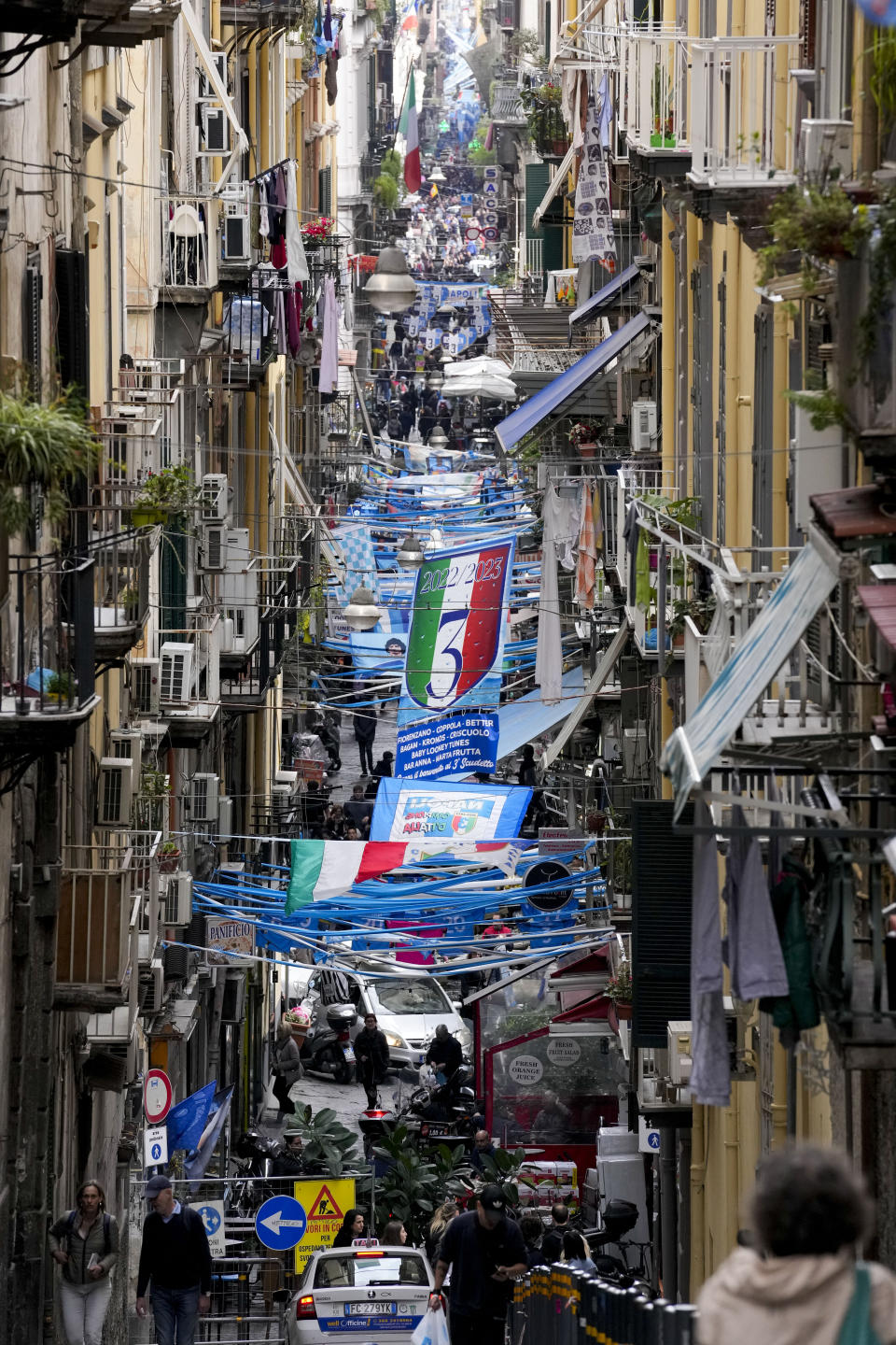 Banners and writings in support of Napoli soccer team are displayed in downtown Naples, Italy, Tuesday, April 18, 2023. It's a celebration more than 30 years in the making, and historically superstitious Napoli fans are already painting the city blue in anticipation of the team's first Italian league title since the days when Diego Maradona played for the club. (AP Photo/Andrew Medichini)