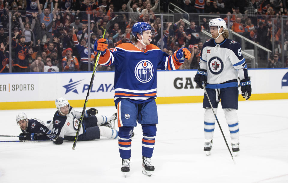 Edmonton Oilers' Kailer Yamamoto (56) celebrates a goal against the Winnipeg Jets during the second period of an NHL hockey game Friday, March 3, 2023, in Edmonton, Alberta. (Jason Franson/The Canadian Press via AP)