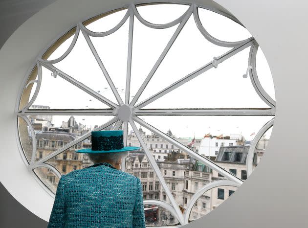 Queen Elizabeth II looks at the view out of a window during a visit to reopen Canada House on Feb. 19, 2015. (Photo: Kirsty Wigglesworth/Pool via AP)