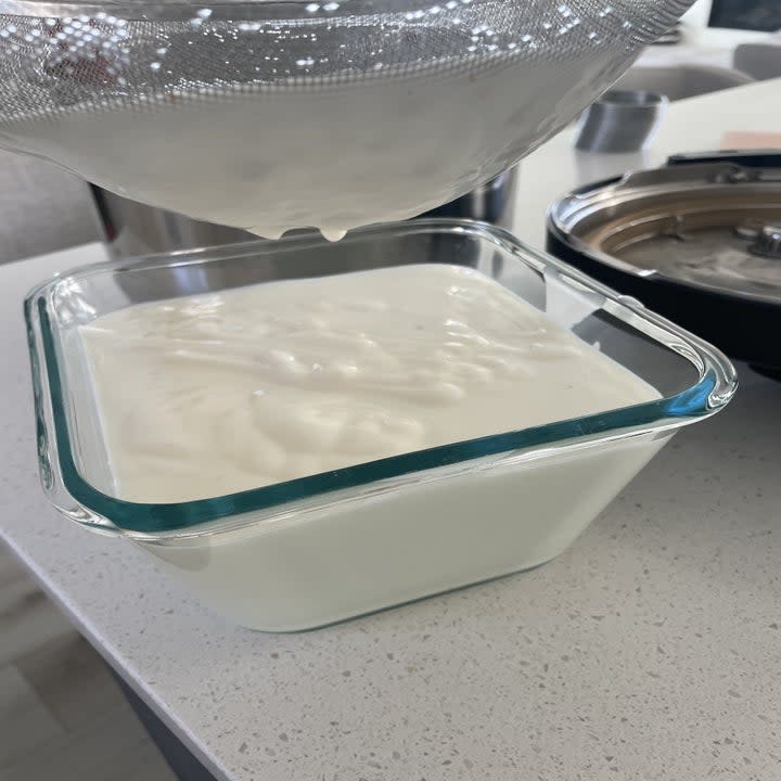 yogurt straining into a container