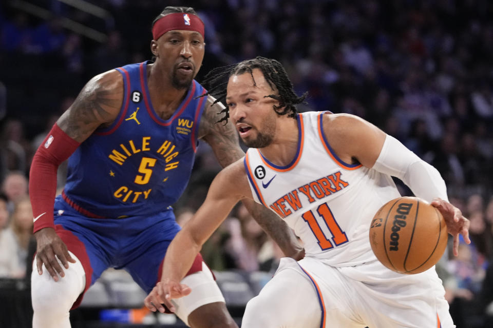 New York Knicks guard Jalen Brunson (11) drives against Denver Nuggets guard Kentavious Caldwell-Pope (5) during the second half of an NBA basketball game, Saturday, March 18, 2023, at Madison Square Garden in New York. Brunson scored 24 points in his return from a left foot injury, leading the New York Knicks to a 116-110 victory. (AP Photo/Mary Altaffer)