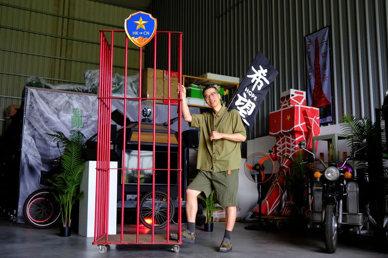 Artist Kacey Wong poses for pictures during an interview with Reuters at his studio in Taichung