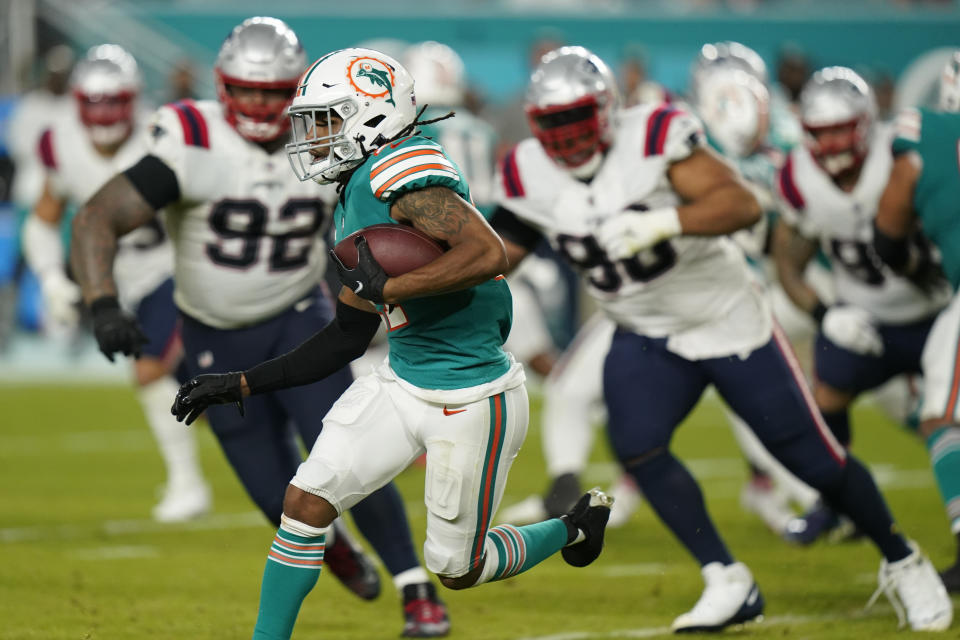 Miami Dolphins wide receiver Jaylen Waddle (17) runs with the ball during the second half of an NFL football game against the New England Patriots, Sunday, Jan. 9, 2022, in Miami Gardens, Fla. (AP Photo/Lynne Sladky)