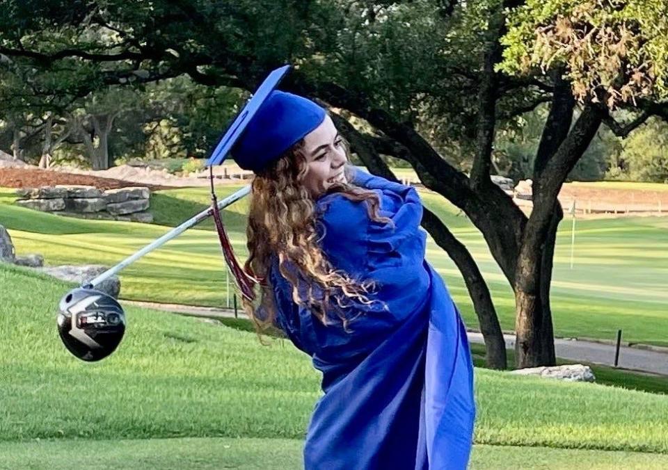 Before graduating from Westlake on Monday, Ally Black posed in cap and gown at Austin Country Club. She will play next year for the University of Virginia.