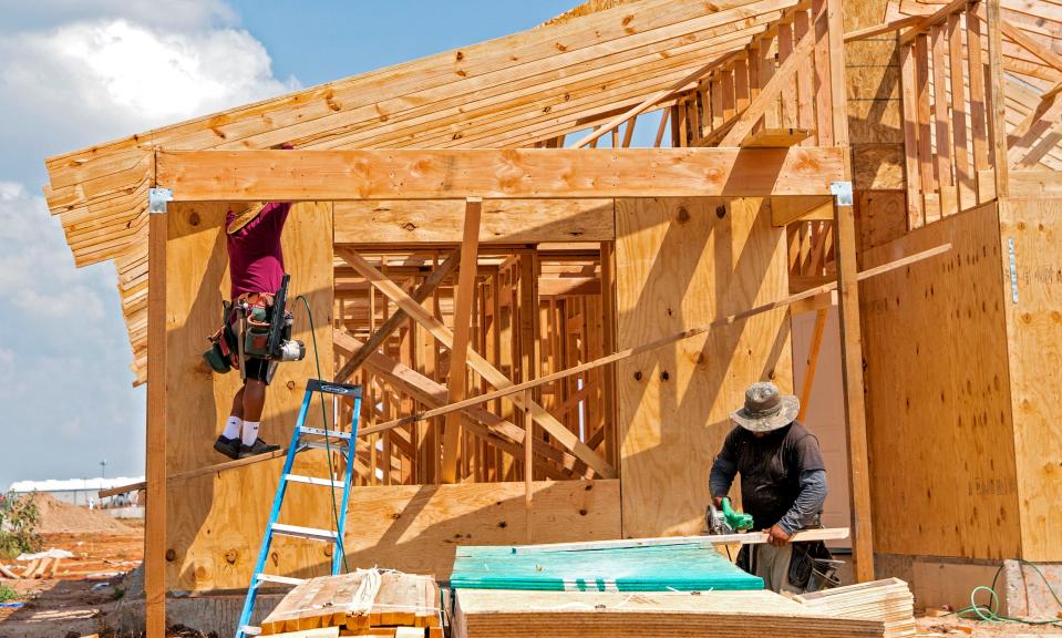 Crews work on a house by Ideal Homes & Neighborhoods in the Abbot Lake addition in southeast Oklahoma City.