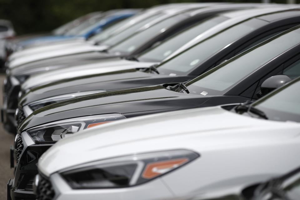 In this May 19, 2019, file photo, a line of unsold 2019 Tucson sports-utility vehicles sits at a Hyundai dealership in Littleton, Colo. Delaware attorneys provide tips to avoid buying a problem vehicle.