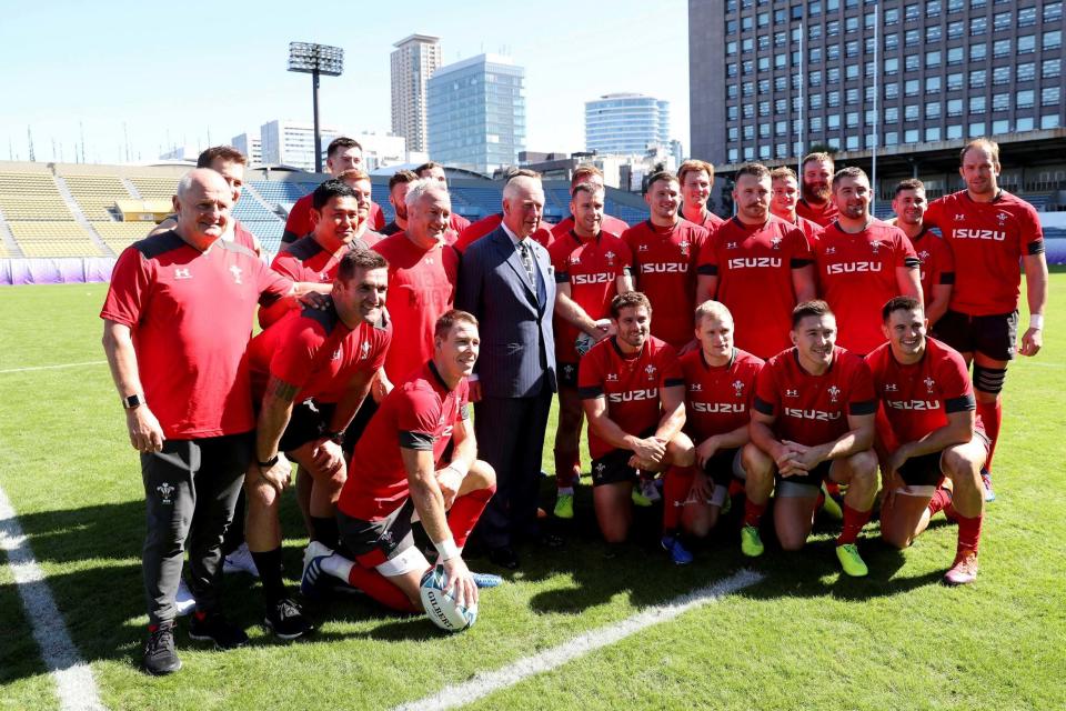 Charles poses with the Wales rugby team (AP)