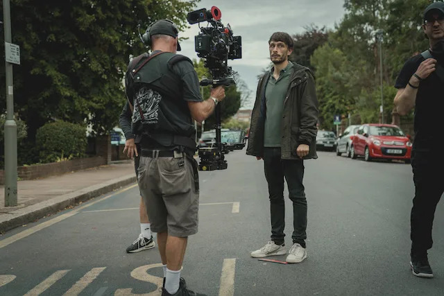 Richard Gadd  in front of the camera on the street in 