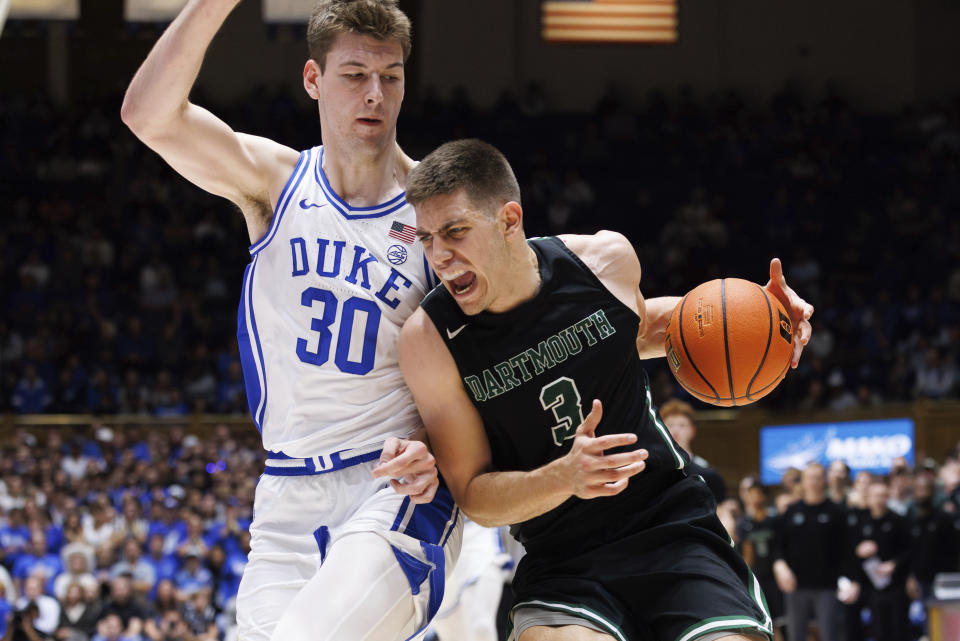 Dartmouth's Dusan Neskovic (3) drives against Duke's Kyle Filipowski (30) during the first half of an NCAA college basketball game in Durham, N.C., Monday, Nov. 6, 2023. (AP Photo/Ben McKeown)