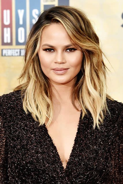 <p><strong>Chrissy Teigen</strong><br>Chrissy Teigen got real about her <a href="http://www.refinery29.com/2016/04/109552/chrissy-teigen-post-pregnancy-acne-selfies" rel="nofollow noopener" target="_blank" data-ylk="slk:post-pregnancy skin" class="link ">post-pregnancy skin</a> back in April, which basically just made us love her even more than we already do. She posted a sad-face selfie on Snapchat with the caption, "Goodbye pregnancy glow. Hi itchy red spots." As Miami-based dermatologist <a href="http://www.refinery29.com/2016/04/109552/chrissy-teigen-post-pregnancy-acne-selfies" rel="nofollow noopener" target="_blank" data-ylk="slk:Dr. S. Manjula Jegasothy" class="link ">Dr. S. Manjula Jegasothy</a> told us, the hormonal roller coaster that women go through after having a baby can result in temporary skin conditions like hives, rosacea, and our favorite epidermis woe, mild cystic acne.</p><p>While newly minted mom Teigen didn't share how she was treating her condition, Dr. Jegasothy suggested using an over-the-counter cortisone cream if you're breast-feeding.</p><span class="copyright">Photo: Rob Latour/REX/Shutterstock.</span>