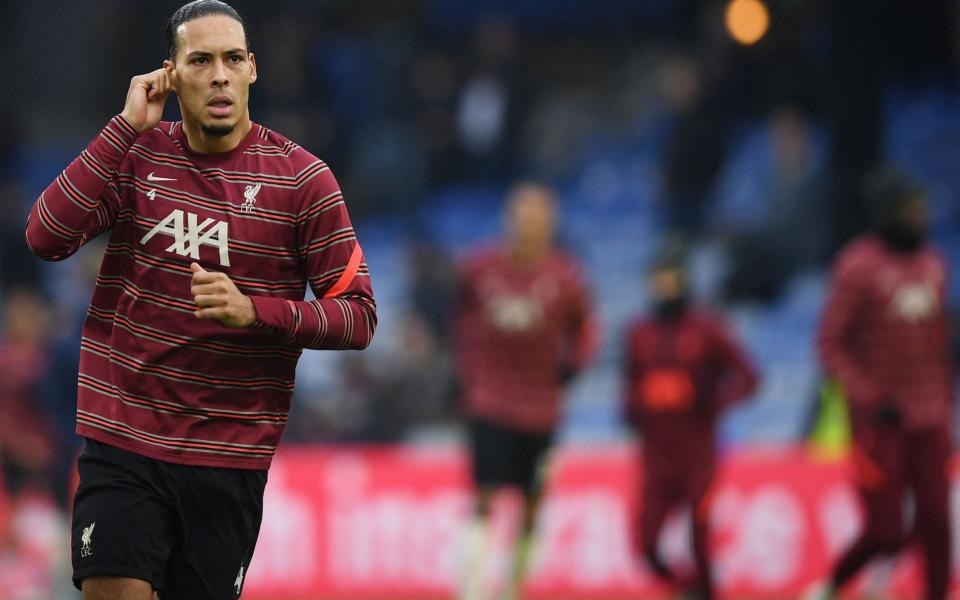  Liverpool's Dutch defender Virgil van Dijk warms up ahead of the English Premier League football match between Crystal Palace and Liverpool at Selhurst Park in south London on January 23, 2022 - AFP