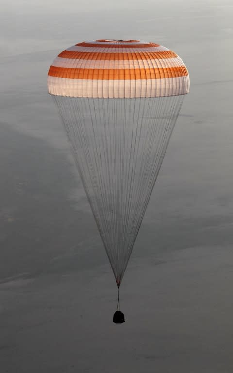 A parachute carrying the Soyuz MS-04 capsule returning from the International Space Station (ISS) - Credit: Sergei Ilinitsky/EPA