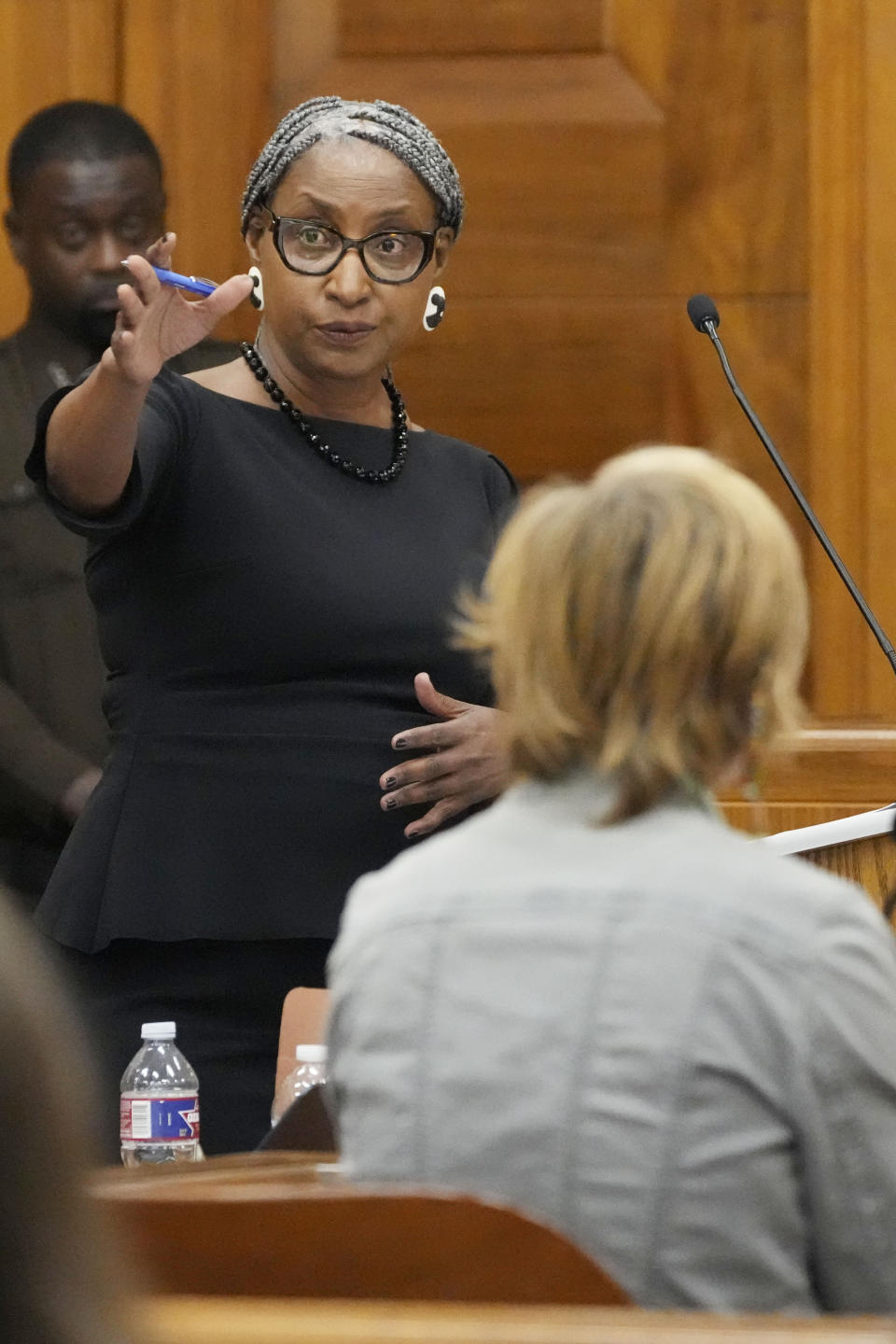 Lisa Ross, left, attorney for Bul Mabil, brother of Dau Mabil, a 33-year-old Jackson, Miss., resident who went missing on March 25 and whose body was found in April floating in the Pearl River in Lawrence County, questions Karissa Bowley, wife of the deceased, during a hearing, on whether a judge should dissolve or modify his injunction preventing the release of Mabil's remains until an independent autopsy could be conducted, Tuesday, April 30, 2024, in Jackson, Miss. (AP Photo/Rogelio V. Solis)