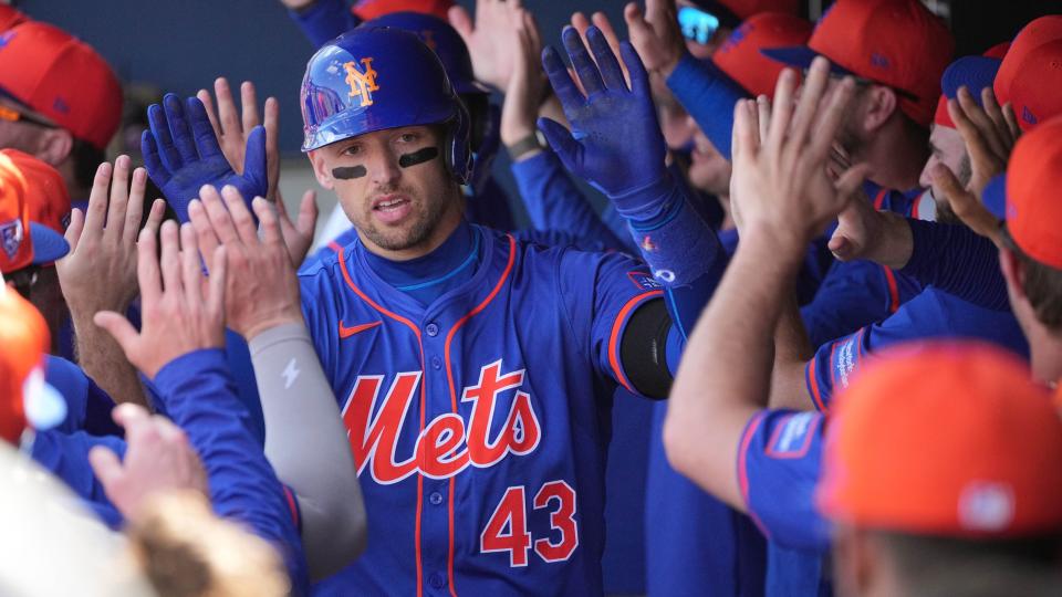Feb 26, 2024; West Palm Beach, Florida, USA; New York Mets left fielder Trayce Thompson (43) is congratulated by teammates after hitting a grand slam against the Washington Nationals in the third inning at CACTI Park of the Palm Beaches.