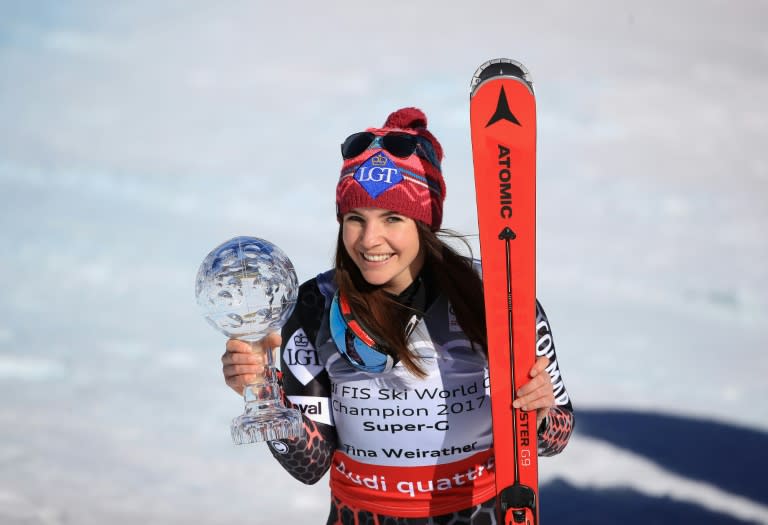 Tina Weirather of Liechtenstein smiles with the globe for winning the overall title for the ladies' Super-G following the ladies' Super-G during the Audi FIS Ski World Cup Finals at Aspen Mountain on March 16, 2017 in Aspen, Colorado