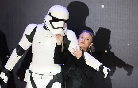 FILE PHOTO - Carrie Fisher poses for cameras as she arrives at the European Premiere of Star Wars, The Force Awakens in Leicester Square, London, December 16, 2015. REUTERS/Paul Hackett/File Photo
