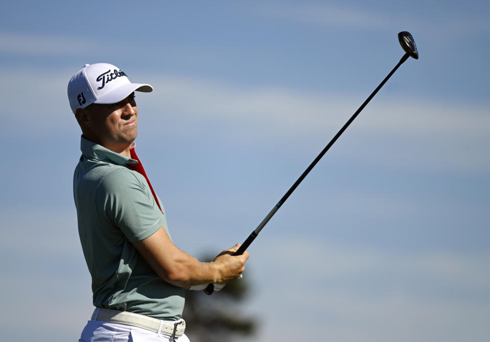 Justin Thomas watches his tee shot on the second hole of the South Course at Torrey Pines during the first round of the Farmers Insurance Open golf tournament, Wednesday, Jan. 26, 2022, in San Diego. (AP Photo/Denis Poroy)