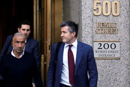 FILE PHOTO: Alain Kaloyeros (L), president of the State University of New York's Polytechnic Institute, walks out of the Manhattan federal courthouse in New York, U.S., September 22, 2016. REUTERS/Bria Webb/File Photo