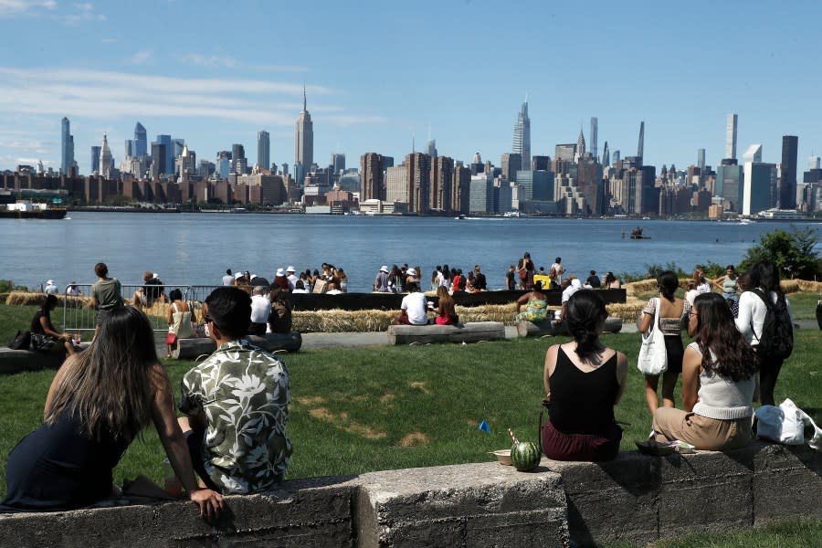 People gather at the Marsha P. Johnson State Park on the Williamsburg East River waterfront on September 04, 2021 in the Brooklyn borough of New York City. (Photo by John Lamparski/Getty Images)