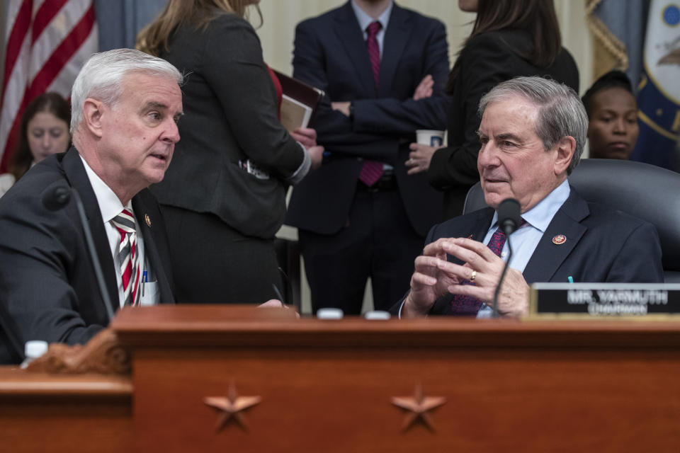 House Budget Committee Ranking Member Rep. Steve Womack, R-Ark., left, and Chairman Rep. John Yarmuth, D-Ky., talk before Office of Management and Budget Acting Director Russell Vought testifies at a hearing of the House Budget Committee about President Trump's budget for Fiscal Year 2021, on Capitol Hill, Wednesday, Feb. 12, 2020, in Washington. (AP Photo/Alex Brandon)