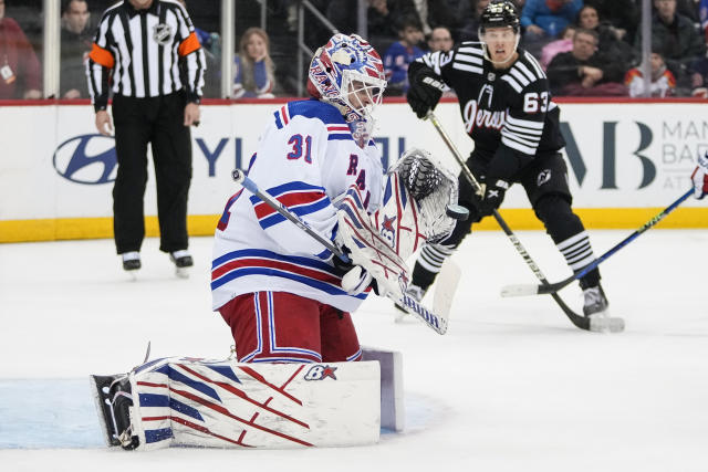 New York Rangers goaltender Igor Shesterkin (31) stops a shot on goal during the second period of an NHL hockey game against the New Jersey Devils Thursday, March 30, 2023, in Newark, N.J. (AP Photo/Frank Franklin II)
