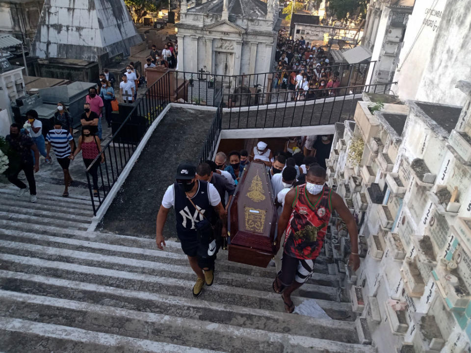 Pallbearers carry Kathlen Romeu's casket at a cemetery in Brazil.