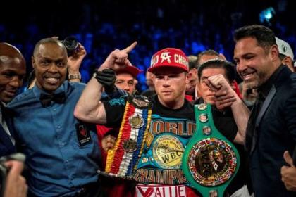Canelo Alvarez poses for a photo after defeating Amir Khan on Saturday. (Reuters)