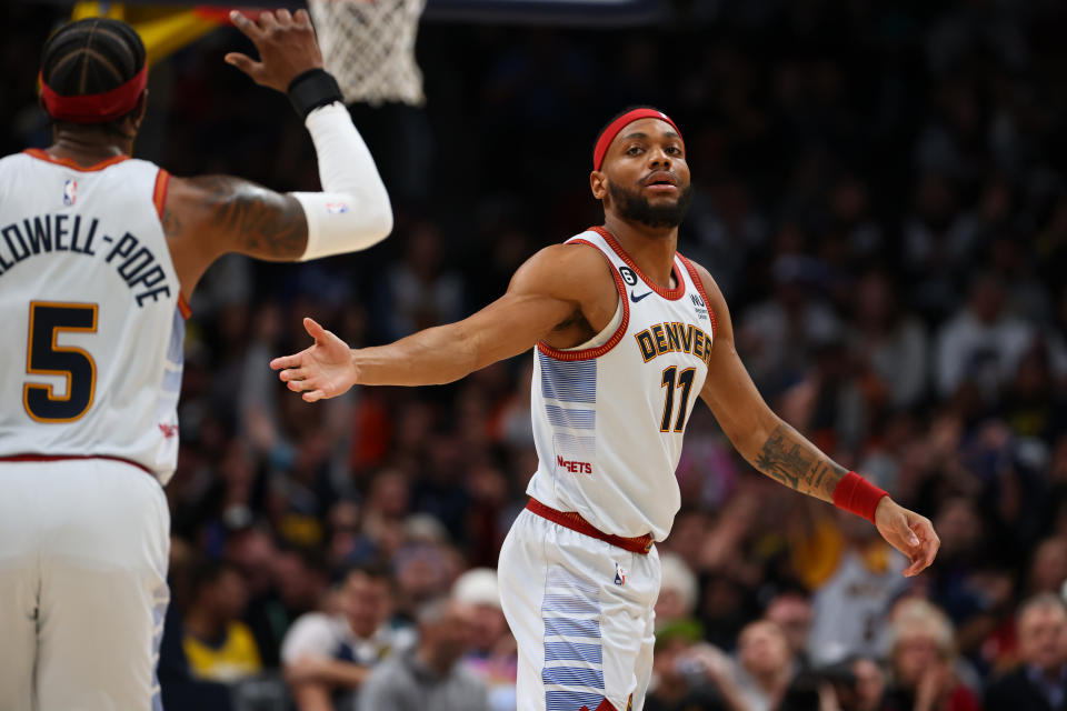 From Bruce Brown and Kentavious Caldwell-Pope in photos. (Photo by Justin Tafoya/Getty Images)