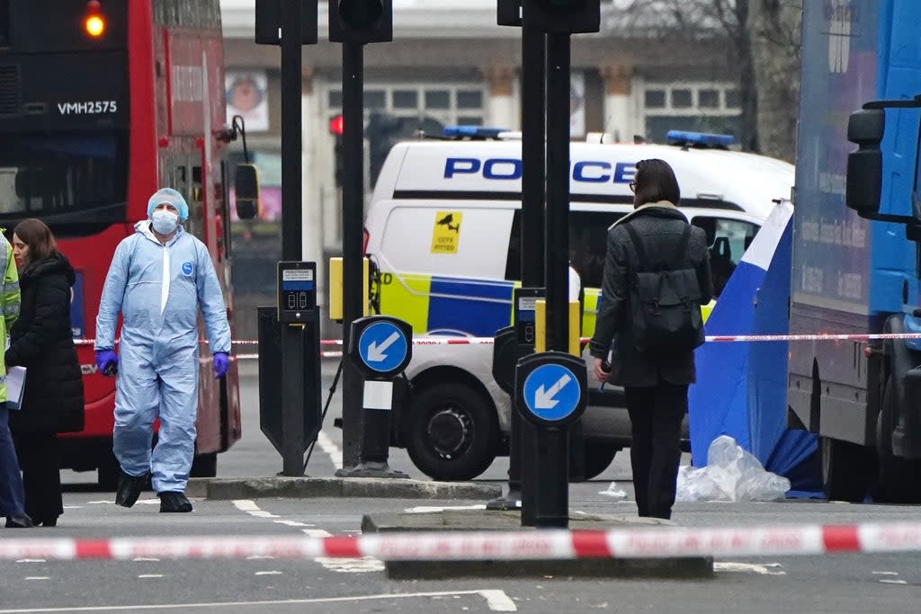 Metropolitan Police officers in a forensic suit at the scene on Chippenham Road, Maida Vale, west London (Aaron Chown/PA) (PA Wire)