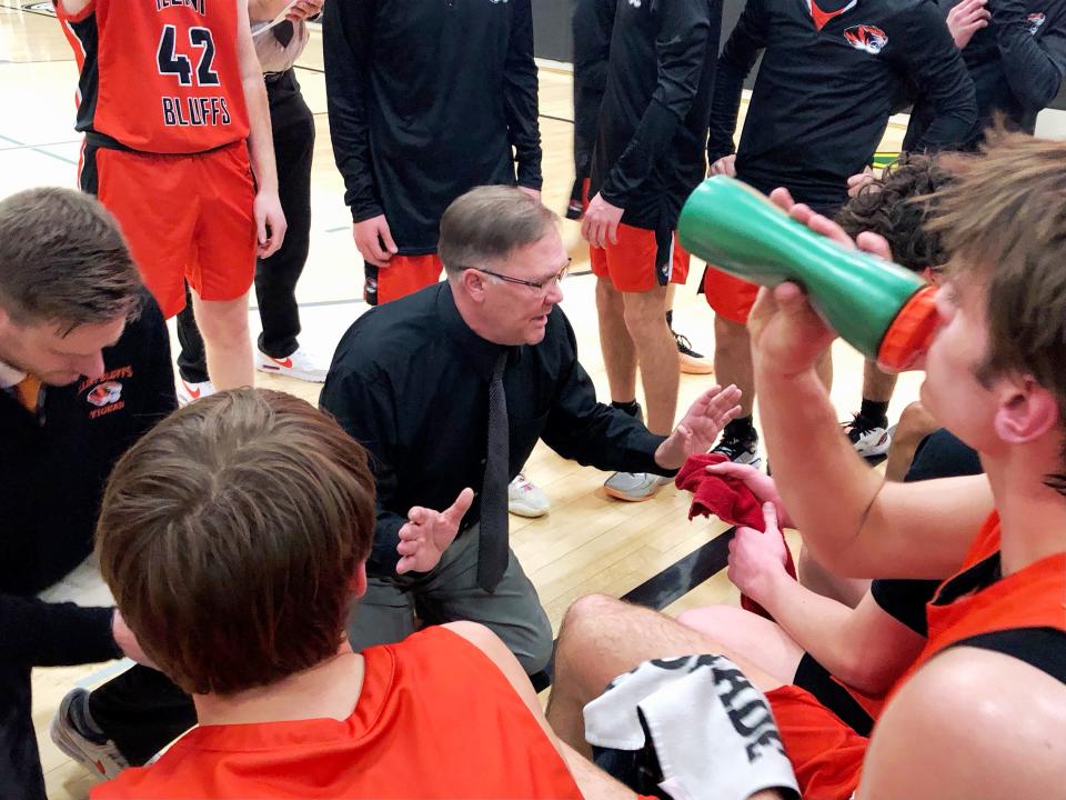 Illini Bluffs head coach Clay Vass talks to his team during a 47-35 victory over Camp Point Central in the IHSA Class 1A boys Abingdon Sectional championship game on Friday, March 1, 2024.