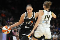 Phoenix Mercury guard Diana Taurasi drives on Chicago Sky guard Allie Quigley (14) during the first half of Game 2 of basketball's WNBA Finals, Wednesday, Oct. 13, 2021, in Phoenix. (AP Photo/Rick Scuteri)