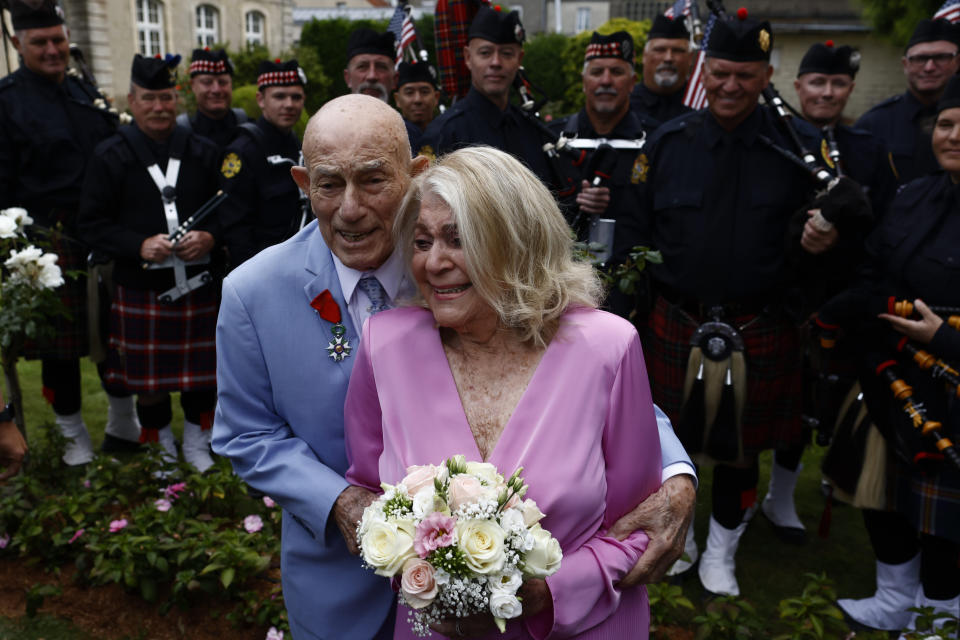 US WWII veteran Harold Terens, 100, left, and Jeanne Swerlin, 96, arrive to celebrate their wedding at the town hall of Carentan-les-Marais, in Normandy, northwestern France, on Saturday, June 8, 2024. Together, the collective age of the bride and groom was nearly 200. But Terens and his sweetheart Jeanne Swerlin proved that love is eternal as they tied the knot Saturday inland of the D-Day beaches in Normandy, France. (AP Photo/Jeremias Gonzalez)