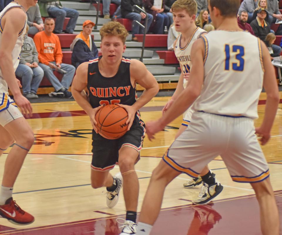 Quincy's Riley Miner goes strong to the hoop Monday versus Centreville in D3 District action