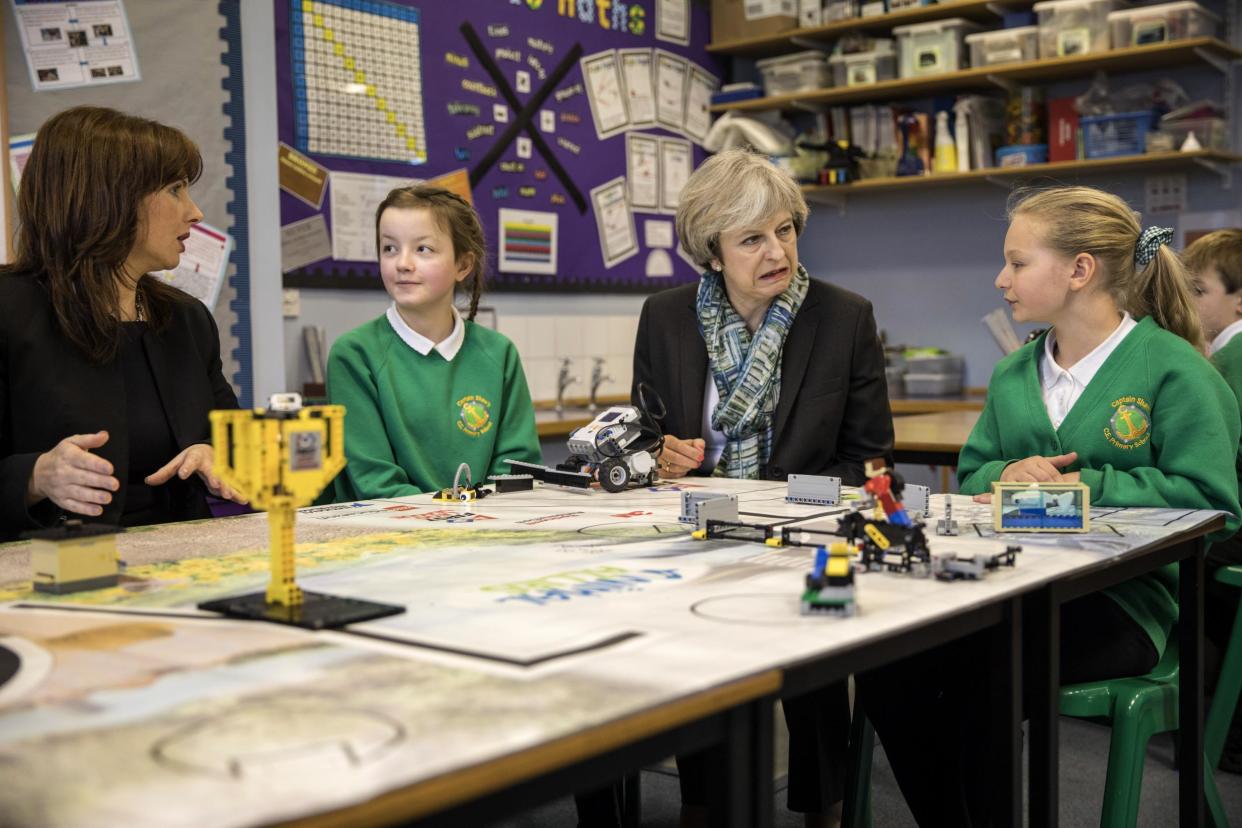 Theresa May visits schoolchildren at Captain Shaw's Primary School: Getty Images