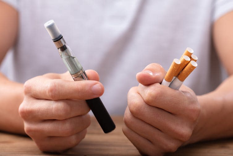 <span class="caption">Both smokers and e-cigarette users had more ‘bad’ microbes.</span> <span class="attribution"><a class="link " href="https://www.shutterstock.com/image-photo/man-holding-vape-tobacco-cigarette-over-1252774594" rel="nofollow noopener" target="_blank" data-ylk="slk:Andrey_Popov/ Shutterstock;elm:context_link;itc:0;sec:content-canvas">Andrey_Popov/ Shutterstock</a></span>