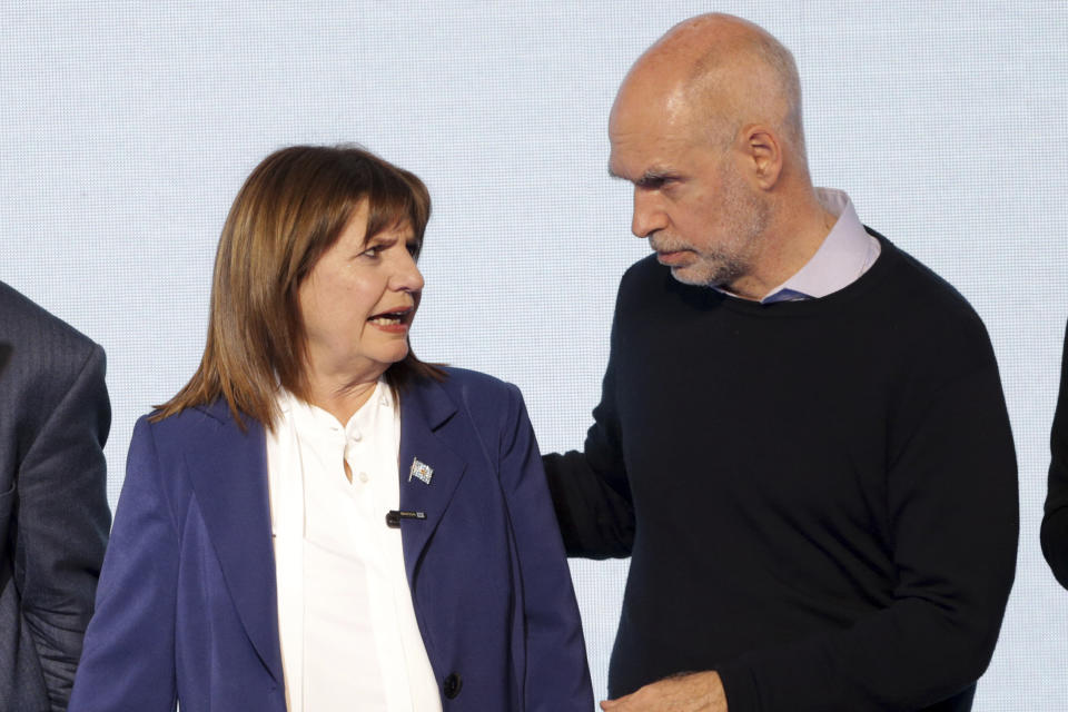 Presidential candidate Patricia Bullrich, left, and former hopeful Horacio Rodríguez Larreta, with the United for Change coalition, speak at their campaign headquarters after polling stations closed during primary elections in Buenos Aires, Argentina, Sunday, Aug. 13, 2023. (AP Photo/Daniel Jayo)