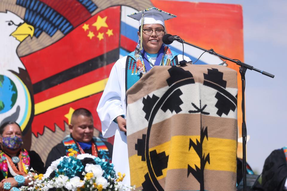 Navajo Preparatory School graduate Amber White gives her valedictorian address to her peers and the crowd on Saturday, May 21, during the commencement exercises.
