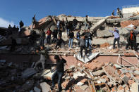 Buildings were destroyed in Van, Turkey as rescue efforts continue.